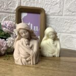 Vela | Madre con bebé
